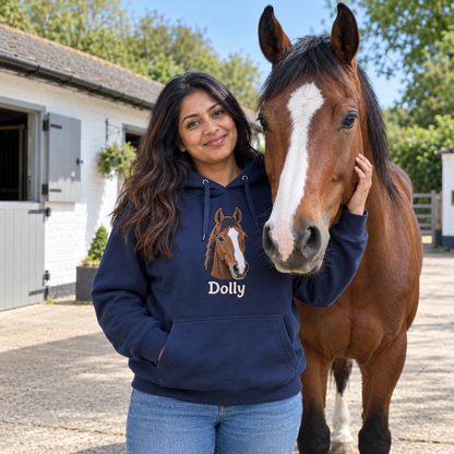 Woman at a stable yard with her bay horse Dolly, wearing a French Navy hoodie embroidered with Dolly